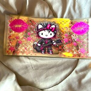 An assortment of hello Kitty UVDTF Transfers